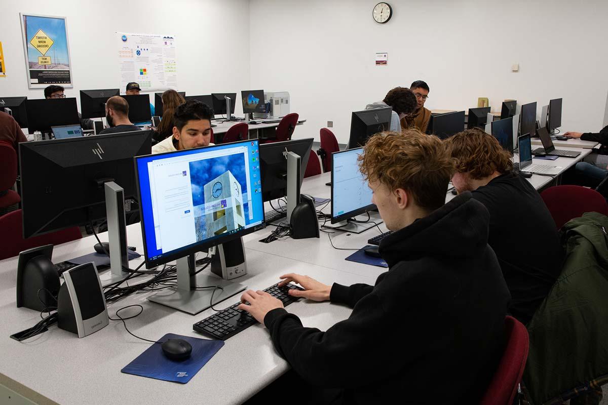 Cybersecurity Center at San Juan College. Students in their classroom on the computers.